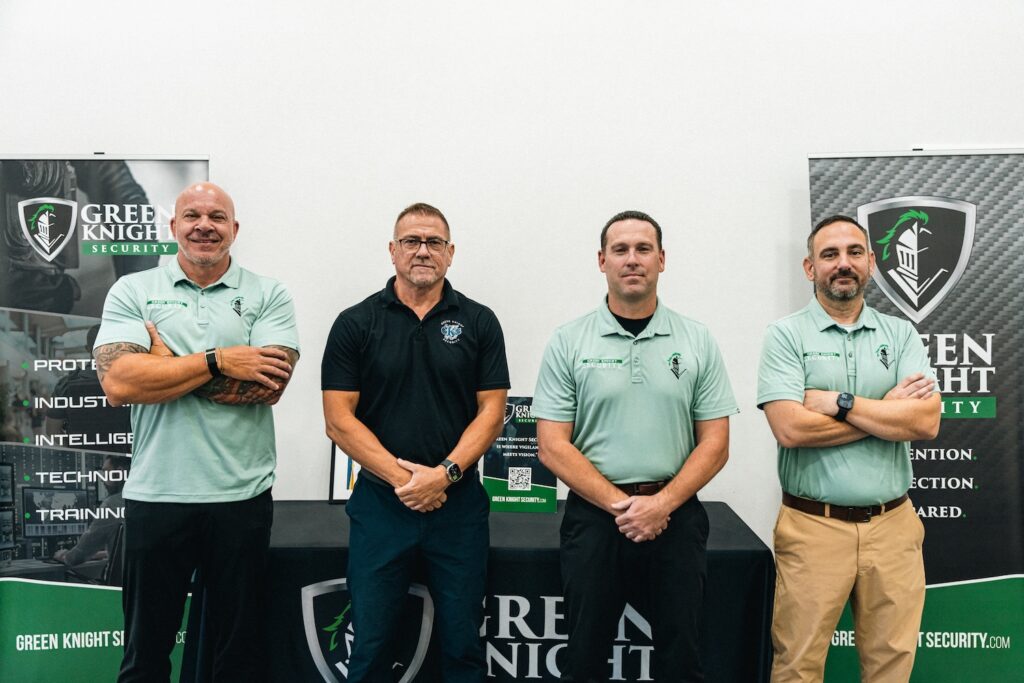 GKS Team standing in front of logo at the California security office.